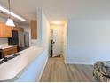 Bright living space with neutral walls, wood-look floors, and seamless flow to the kitchen area at 119 Brentwood Dr. # D, Murrells Inlet, SC 29576