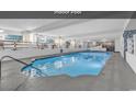 Large indoor pool with murals and tables at 1210 N Waccamaw Dr. # 1008, Garden City Beach, SC 29576