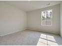Bright bedroom with carpet flooring and a window offering a view of the outdoors at 150 Waterloo Sunset Dr., Longs, SC 29568