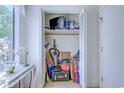 Open closet filled with supplies and household items, offering convenient storage solutions at 1500 Cenith Dr. # D 103, North Myrtle Beach, SC 29582