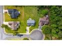An aerial shot displaying the home, its expansive lawn, patio area, and neighborhood layout at 1505 Bramber Pl., Conway, SC 29527