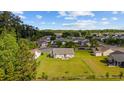An aerial view showcases the home's backyard with a patio and a large, fenced-in yard at 1505 Bramber Pl., Conway, SC 29527
