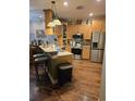 Well-equipped kitchen featuring stainless steel appliances, countertops, and a convenient breakfast bar at 1717 Perdiz Covey Ct., Myrtle Beach, SC 29588