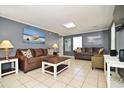 Comfortable living room featuring tile floors, a cozy seating arrangement, and neutral-toned walls at 219 27Th Ave. N, North Myrtle Beach, SC 29582