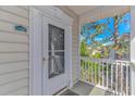 Exterior shot of the front door and outside porch area at 2312 Sweetwater Blvd. # 2312, Murrells Inlet, SC 29576