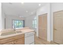 Kitchen with breakfast bar and open view of main living space at 2312 Sweetwater Blvd. # 2312, Murrells Inlet, SC 29576