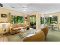 Bright living room with large windows offering views of the surrounding landscape at 234 Westleton Dr. # 21-C, Myrtle Beach, SC 29572