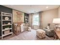Charming Bedroom with a crib, soft lighting, and a window view at 2425 Watershed Way, Longs, SC 29568