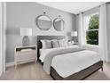 Serene bedroom with neutral tones, a large window with lots of light, and stylish decor at 2525 Watershed Way, Longs, SC 29568