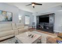 Cozy living room featuring a large TV and comfortable seating at 311 2Nd Ave. N # 210, North Myrtle Beach, SC 29582