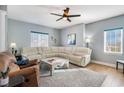 Spacious living room with modern ceiling fan, plush seating, and natural light at 311 2Nd Ave. N # 210, North Myrtle Beach, SC 29582