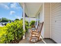 Inviting front porch with rocking chairs and lush landscaping at 381 Winslow Ave., Myrtle Beach, SC 29588