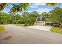 Rear view of property showcasing detached garage and fenced-in yard at 4023 Murrells Inlet Rd., Murrells Inlet, SC 29576