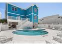 Beautiful private pool and spa area, surrounded by lounge chairs and lush landscaping at 4206 S Ocean Blvd., North Myrtle Beach, SC 29582