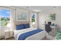 Bright bedroom with large windows, a comfortable bed, and a desk area with water view at 432 Falling Leaf Loop, Myrtle Beach, SC 29588