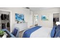 Spacious bedroom with a walk-in closet, and desk area featuring calming coastal artwork at 432 Falling Leaf Loop, Myrtle Beach, SC 29588