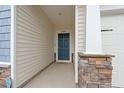 View of front door with stone columns at 4609 Day Lily Run St., Myrtle Beach, SC 29579