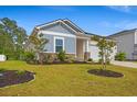 Beautiful home with manicured lawn and stone accents at 4609 Day Lily Run St., Myrtle Beach, SC 29579