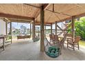 Relaxing outdoor space featuring hanging hammocks and a dining table underneath the raised beach house at 48 Sw Wilmington St., Ocean Isle Beach, NC 28469
