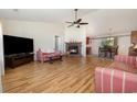 Cozy living room with a fireplace, vaulted ceilings, and wood laminate flooring at 706 Chippendale Dr., Myrtle Beach, SC 29588