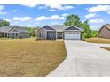 New single-story home with an attached two-car garage and large front yard at 722 Highway 348, Loris, SC 29569