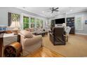 Inviting living room with ample seating, bright windows, and stylish decor for comfortable living at 77 Streater Ln., Pawleys Island, SC 29585
