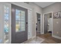 Foyer featuring decorative glass door, hardwood floors, and access to a bathroom and bedroom at 804 Twickenham Loop, Longs, SC 29568