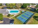 Aerial view of community amenities: a swimming pool, shuffleboard, and pickleball courts at 88 Purple Martin Dr., Murrells Inlet, SC 29576