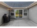 Cozy outdoor patio with concrete flooring and easy access through sliding glass doors at 101 Alpharetta Ct., Conway, SC 29526