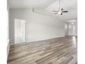 Bright living room with vaulted ceiling, ceiling fan, and hardwood flooring at 109 Old Chimney Ln, Conway, SC 29526