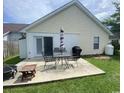 Outdoor patio area with table, chairs, grill, and privacy fence; perfect for entertaining at 117 Wagon Wheel Ln., Surfside Beach, SC 29575