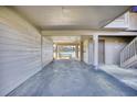View through the covered parking area towards the water, offering a glimpse of the scenic surroundings at 124 Spartina Ct. # 30, Pawleys Island, SC 29585