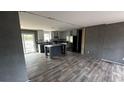Bright kitchen features stainless appliances, center island, and sliding glass doors to the exterior at 1301 Rabbit Ln., Conway, SC 29526