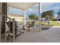 Inviting front porch with comfortable seating, perfect for relaxing and enjoying the outdoors at 133 Lakeside Crossing Dr., Conway, SC 29526