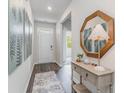 Inviting entryway featuring stylish decor, a console table, and elegant mirror at 1406 Nokota Dr., Conway, SC 29526