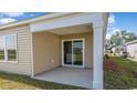 Cozy covered patio with sliding glass doors, perfect for outdoor relaxation at 1406 Nokota Dr., Conway, SC 29526