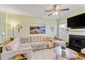 Bright living room features a comfy sectional, modern decor, and a ceiling fan at 1439 Brighton Ave., Myrtle Beach, SC 29588