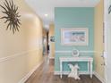 Charming entryway with soft colors, a decorative table, and wall art at 200 53Rd Ave. N # 409, North Myrtle Beach, SC 29582