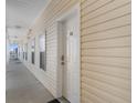 Exterior shot of unit 409, showcasing the hallway leading to the entrance door at 200 53Rd Ave. N # 409, North Myrtle Beach, SC 29582