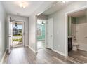 Inviting entryway with wood-look floors, neutral paint, and views to the bathroom, bedrooms and front door at 2825 Mcdougall Dr., Conway, SC 29526