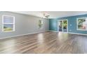 Spacious living room features wood-look floors, natural light, with sliding glass doors at 2825 Mcdougall Dr., Conway, SC 29526