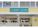 Exterior shot showing Garden Sands signage and parking garage at 301 N Waccamaw Dr. # 110, Murrells Inlet, SC 29576