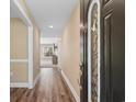 Inviting entryway with wood flooring and a decorative front door with glass detail at 3926 Long Avenue Ext., Conway, SC 29527