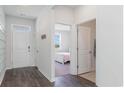 Bright foyer with hardwood floors leading to a bedroom with a window view at 399 Acosta Circle, Conway, SC 29527