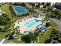 Aerial view featuring a community pool, tennis court and manicured grounds at 4046 Fairway Lakes Dr. # 4046, Myrtle Beach, SC 29579