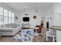 Bright living room featuring coastal decor, vaulted ceiling, and modern furnishings at 4341 Grande Harbour Blvd., Little River, SC 29566
