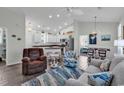 Open living space featuring a kitchen, dining area, and comfortable seating with coastal accents at 4341 Grande Harbour Blvd., Little River, SC 29566