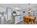 Eat-in kitchen featuring granite countertops, stainless faucet, and tile floors at 4522 N Plantation Harbour Dr. # E-3, Little River, SC 29566