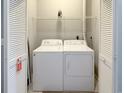 Functional laundry area with washer, dryer, and ample storage space at 4532 Girvan Dr. # A, Myrtle Beach, SC 29579