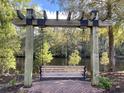 Relaxing outdoor swing with a view of a serene pond, perfect for enjoying peaceful moments in nature at 4750 N Huckleberry Ln., Conway, SC 29526